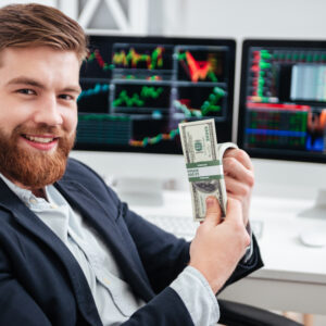 graphicstock cheerful bearded young businessman sitting and holding dollars in office rI2U8dQ 2e