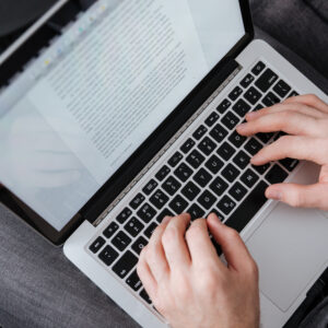 graphicstock close up portrait of a man typing on laptop while sitting on sofa SuxJww2I3l