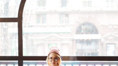 graphicstock concentrated young woman in hat and glasses working with laptop in cafe BkWgKO0pe 1